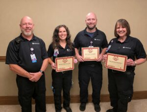 Pictured from left: Mike Lang, Mahaska Health Emergency Services Director; Mahaska Health paramedics Angie Goemaat, Rob Forschler and Shannon Smith.