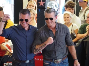  U.S. Rep. Zach Nunn and U.S. Defense Secretary Pete Hegseth posed for photos at a Nunn campaign event held at JR’s Southpork Ranch at the Iowa State Fair Aug. 17, 2026. (Photo by Robin Opsahl/Iowa Capital Dispatch)