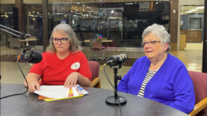 Sheila Guiter (left) and Cathy Griffis stopped by the studio to talk about Christmas fundraising.