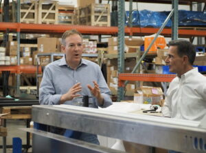  U.S. Environmental Protection Agency Administrator Lee Zeldin, left, spoke with Albert Marasco, CEO of Summit Products on a tour of the Summit Products manufacturing facility in Altoona Oct. 11, 2026. (Photo by Robin Opsahl/Iowa Capital Dispatch)